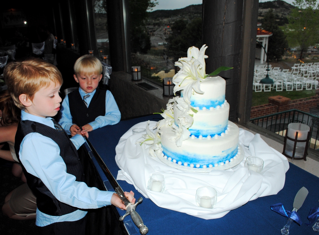 young cousins, a sword, and the wedding cake