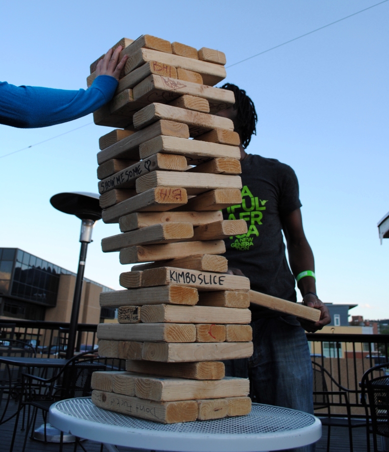 odessa catching the falling tower, saving a few people sitting at a table