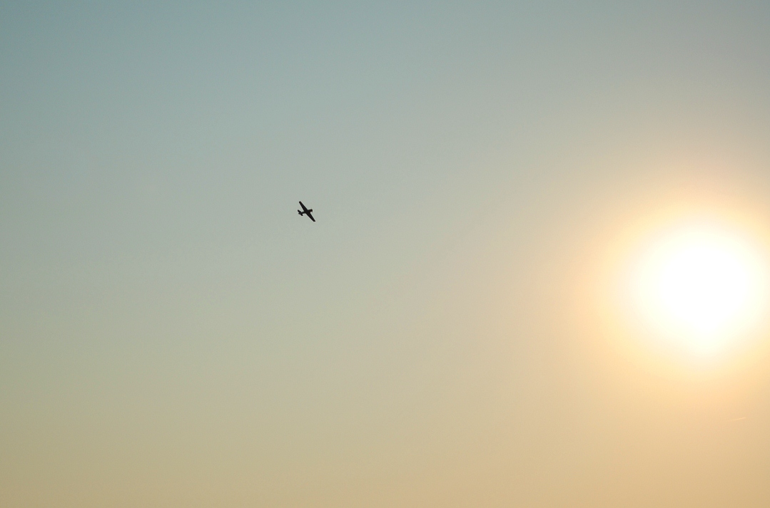 plane and sun