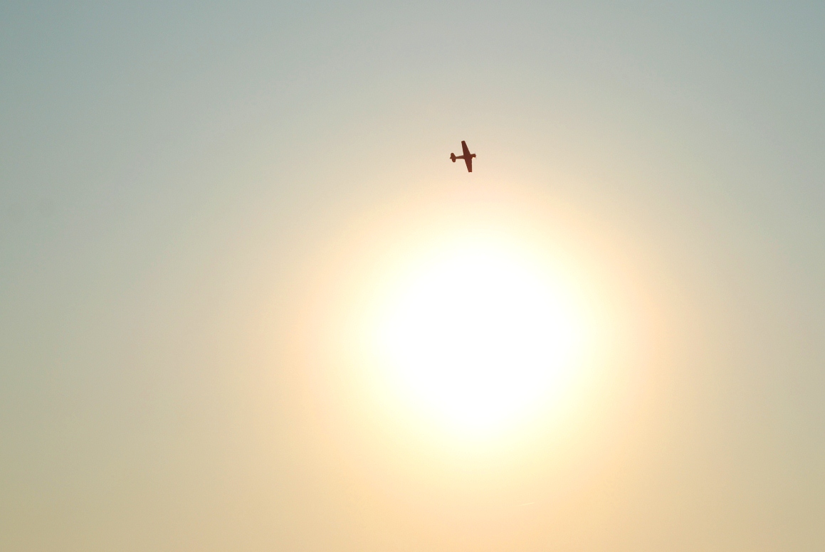 plane and sun